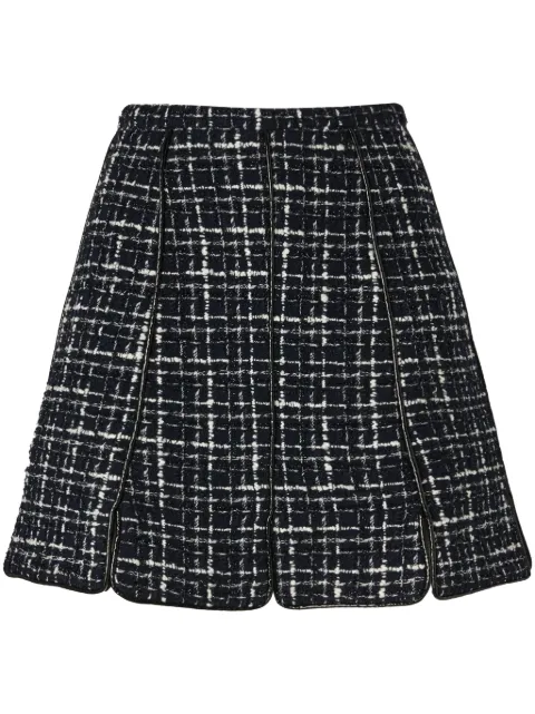 Genny falda corta de tweed con paneles
