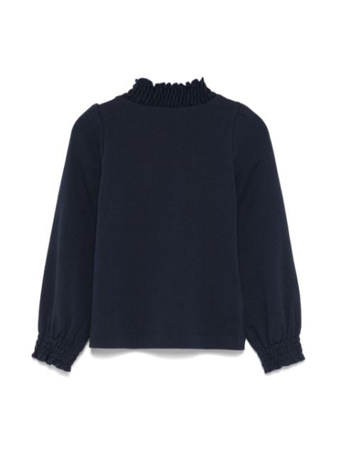 ruffled turtleneck top