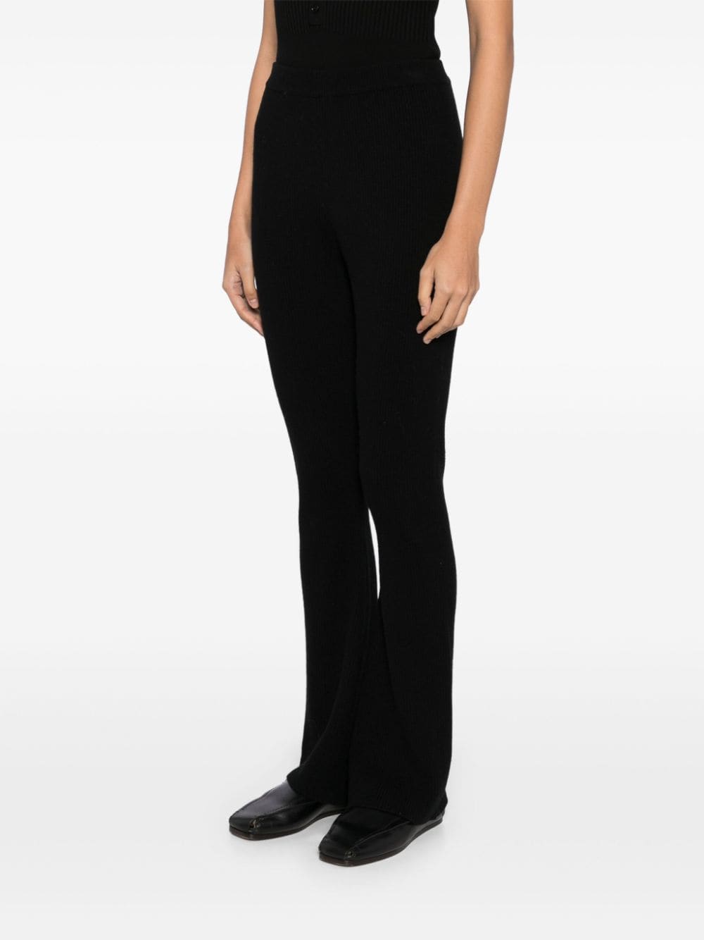 Shop Izaak Azanei Ribbed Flared Trousers In Black