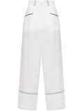 A.M.G. piped-trim trousers - White