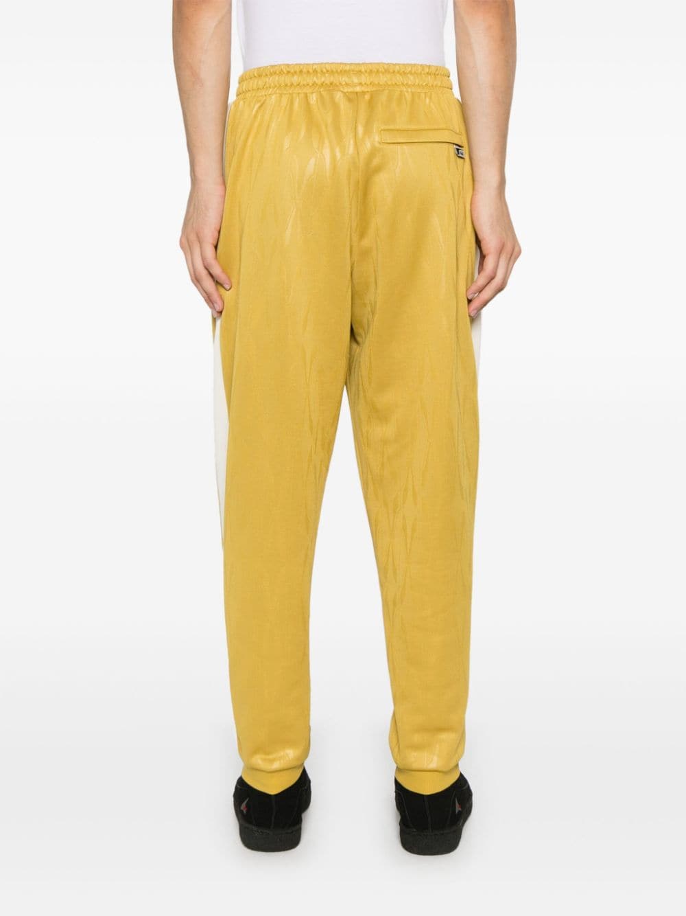 Shop Puma The Neverworn Iv T7 Track Pants In Yellow