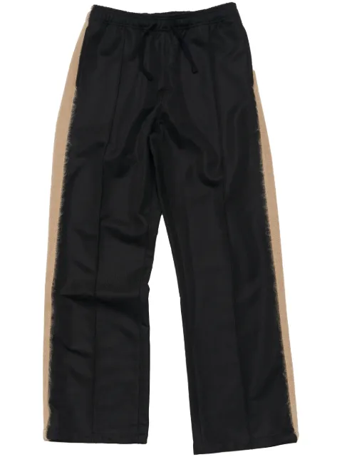 Stockholm Surfboard Club pants con rayas laterales