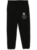 HUGO logo and slogans print track pants - Black