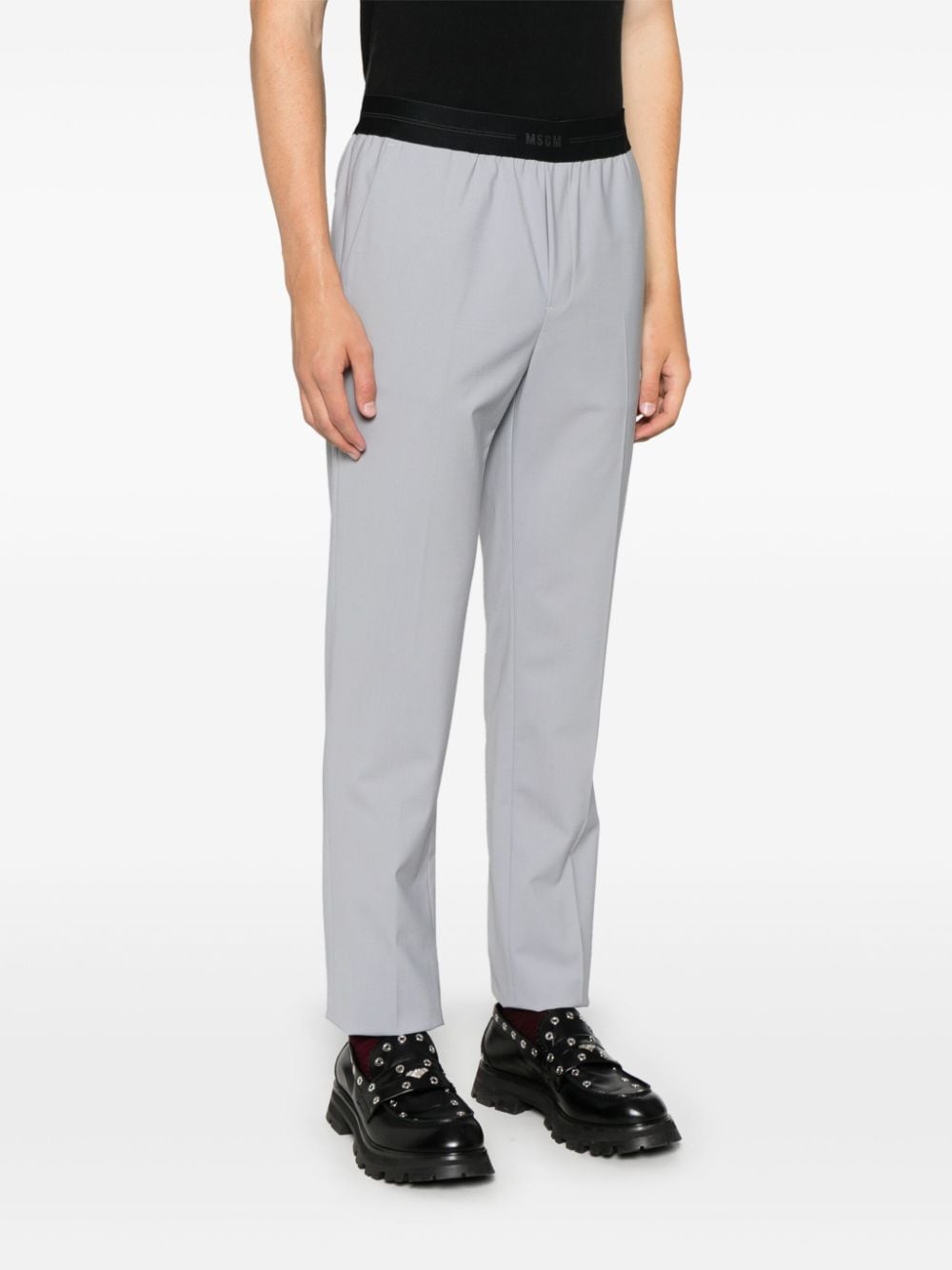 Shop Msgm Logo-waistband Trousers In Grau