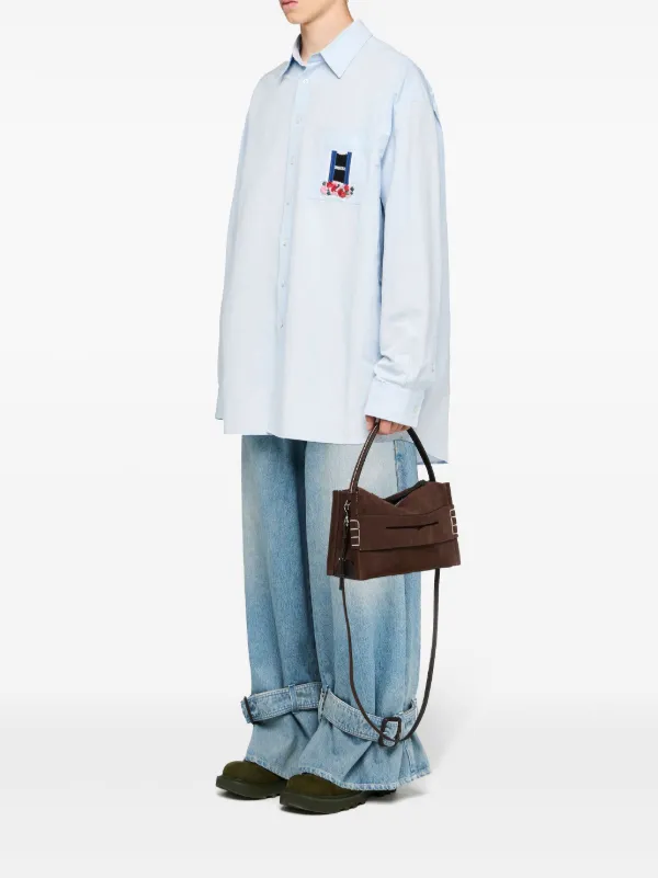 JW Anderson Buckled Cuff Jeans | Blue | FARFETCH