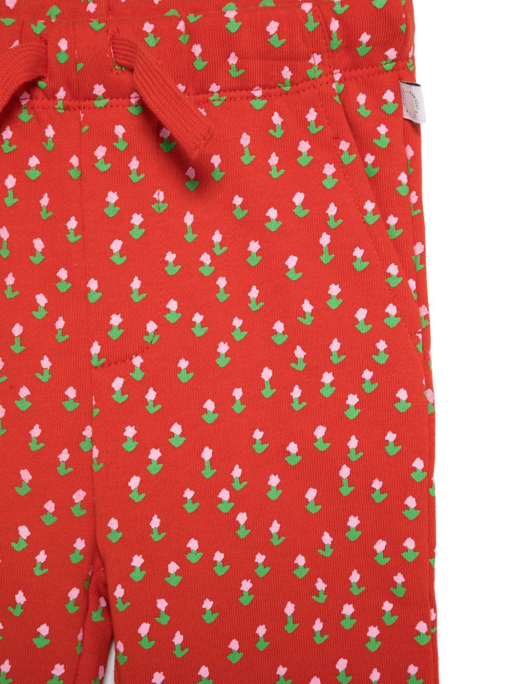 Stella McCartney Kids Trainingsbroek met bloemenprint Rood