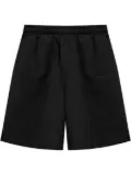 VETEMENTS logo-embroidered track shorts - Black