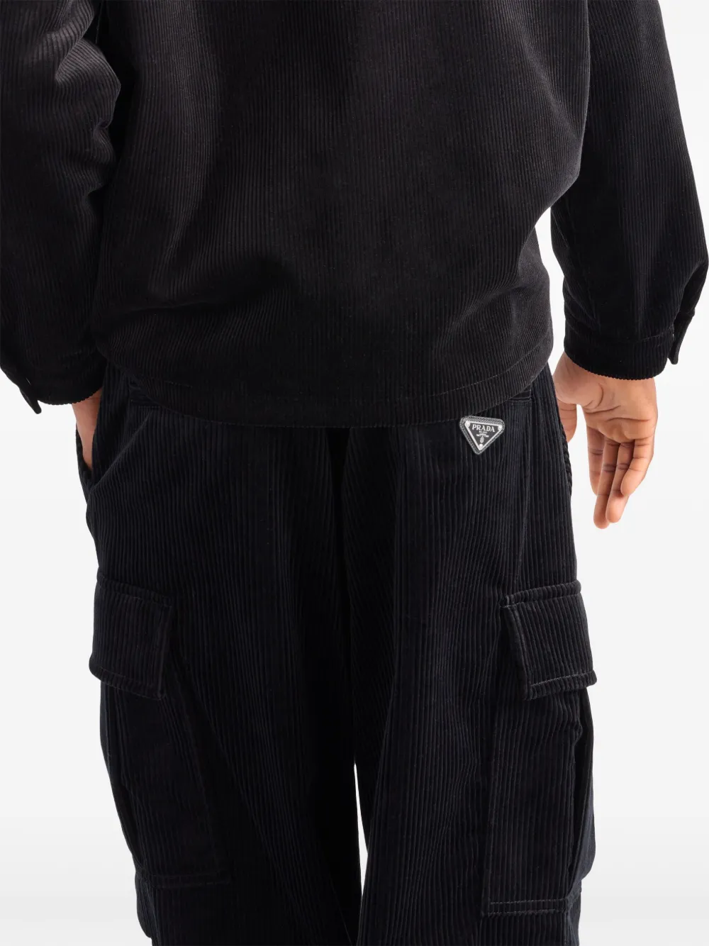 Prada Ribfluwelen broek met toelopende pijpen en email Zwart