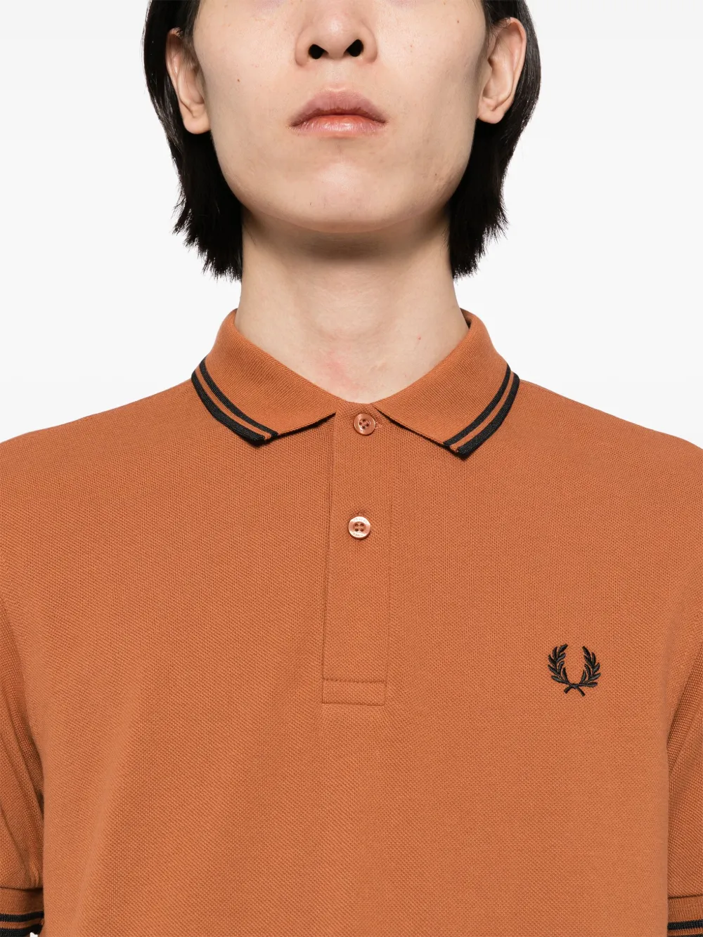 Orange fred perry polo hotsell