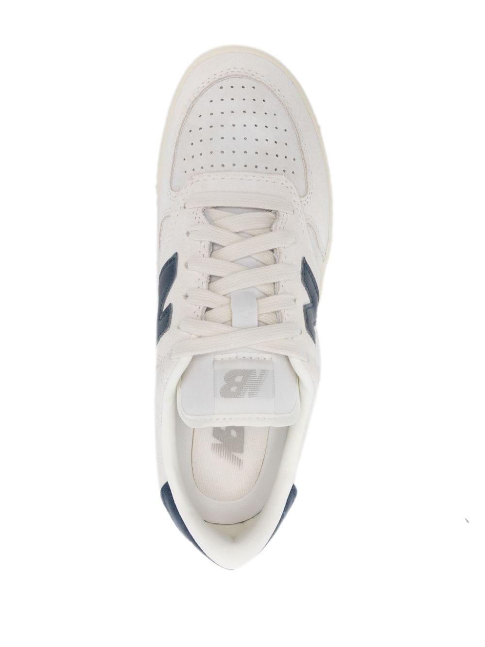 Shop New Balance T500 Sneakers In White