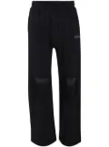 Les Benjamins ripped track pants - Black