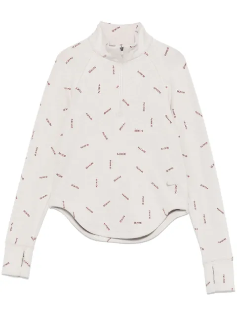 Nike top con medio cierre y logo estampado