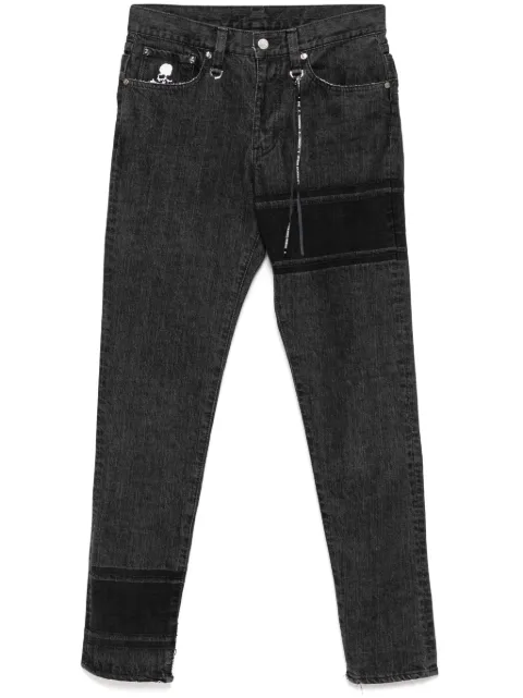 Mastermind World skinny jeans con logo bordado