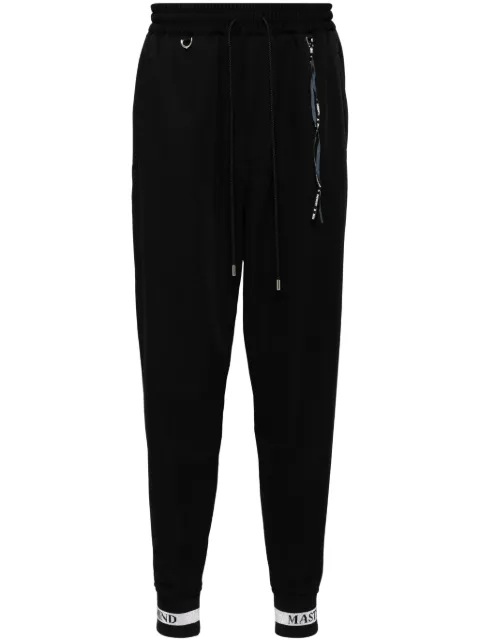 Mastermind World logo print track pants
