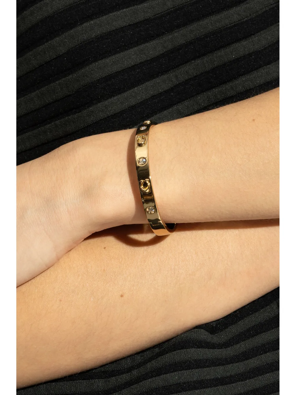 Coach Armband verfraaid met kristallen - Goud