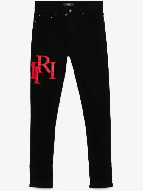AMIRI staggered logo skinny jeans