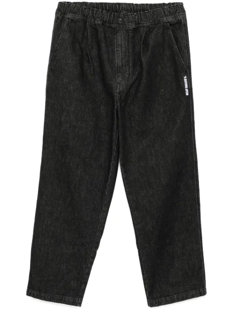 A BATHING APE® jeans con pinzas