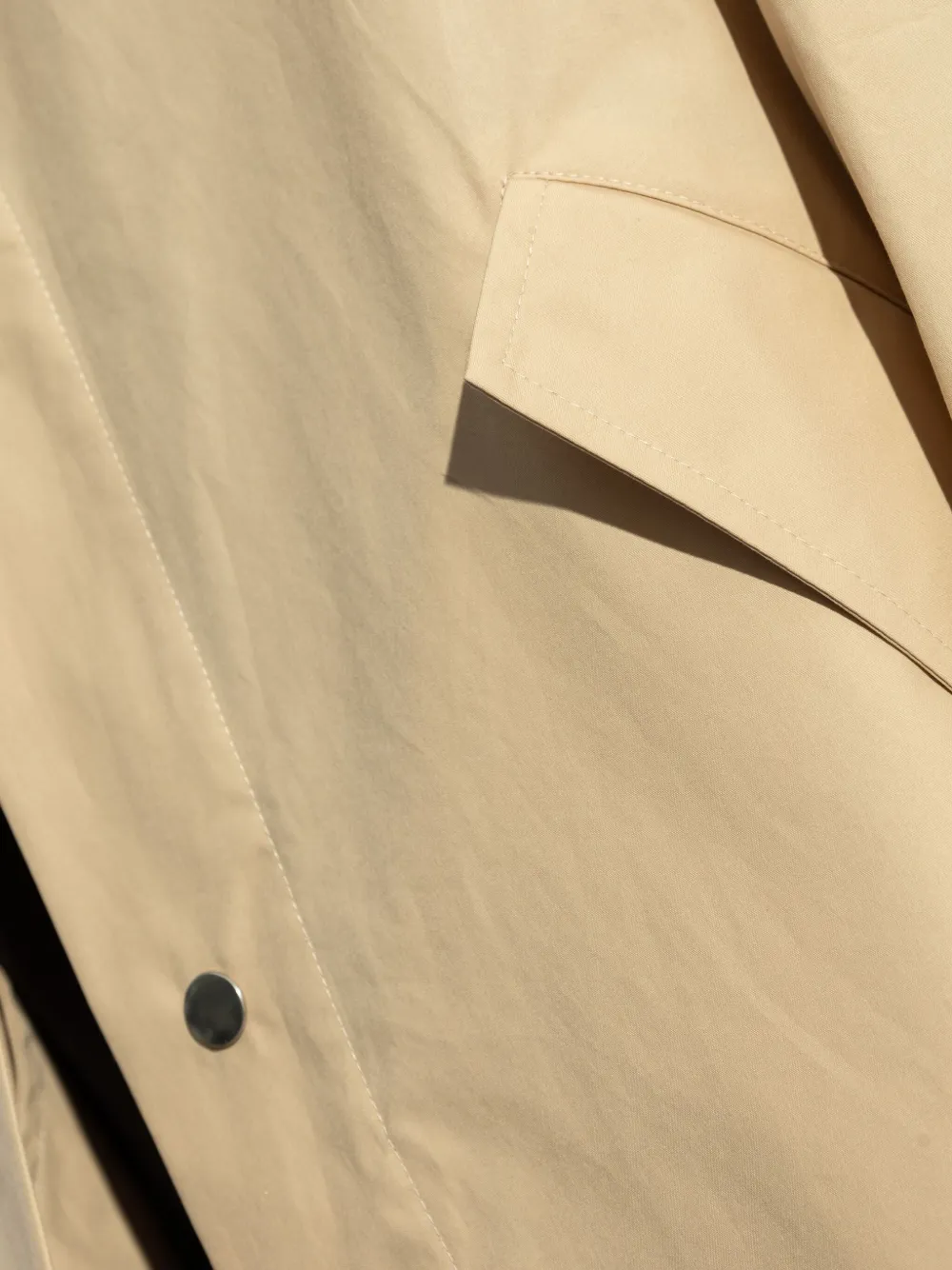 Jil Sander Regenjas met logoprint Beige