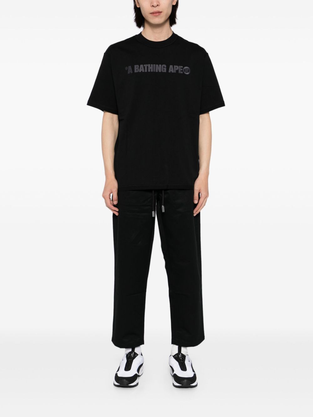 A BATHING APE® Asymmetrische broek met apenkop - Zwart