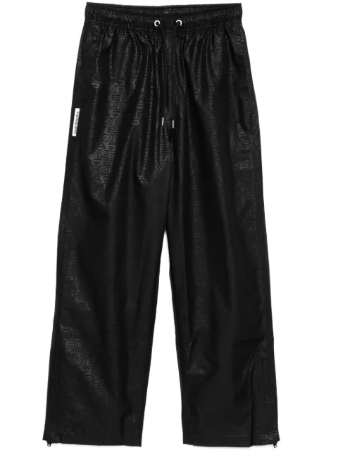 A BATHING APE® monogram-printed pants