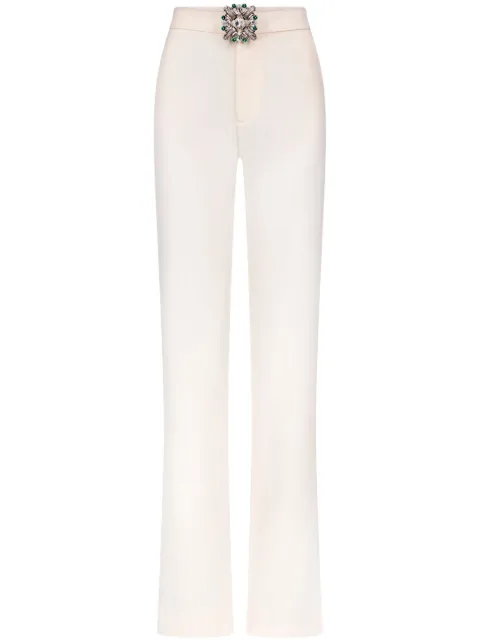 AREA pantalones con broche de cristal