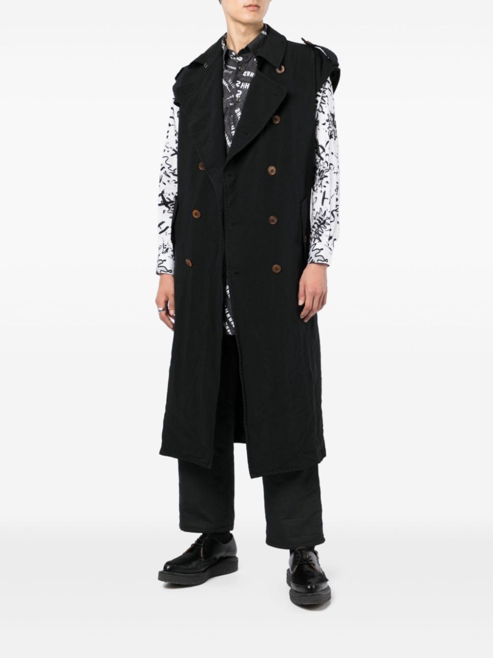 Black Comme Des Garçons sleeveless trench coat