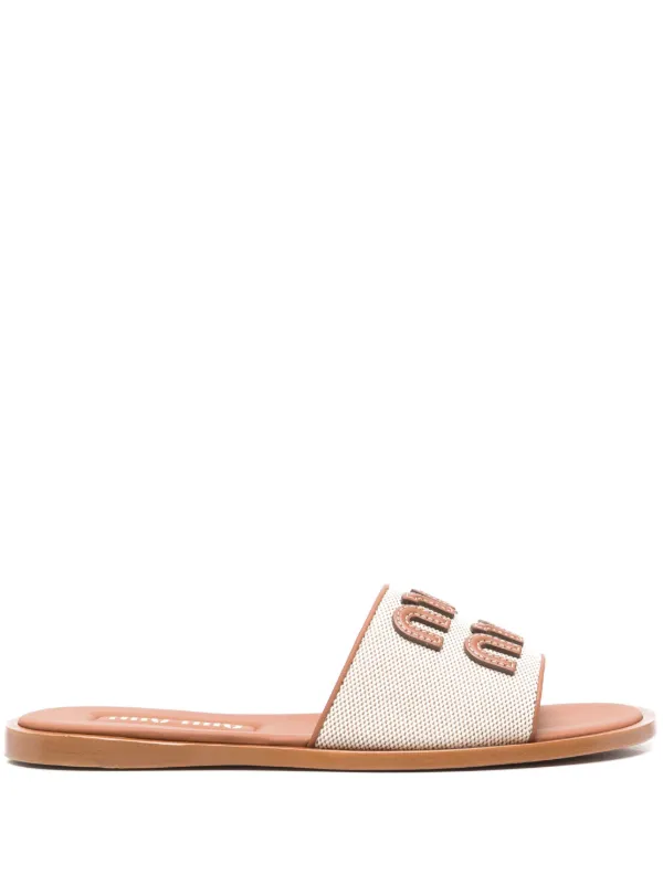 【miumiu】Logo Slide Slippers ★送料関税込★追跡可能★ Miu Miu appliqué-logo Slides | Brown | FARFETCH
