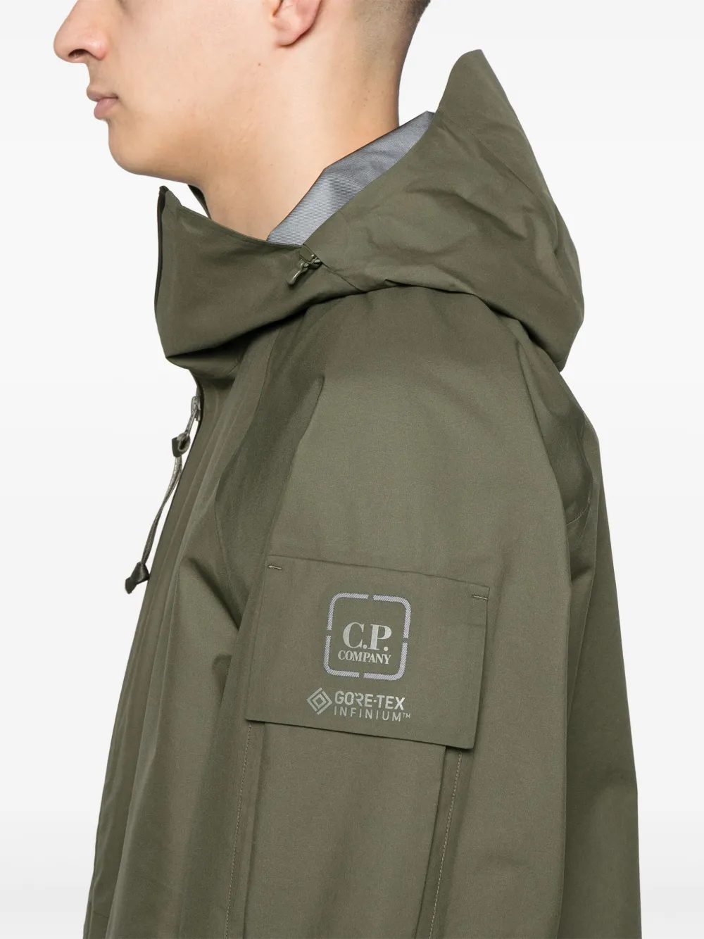 C.P. Company Jack met capuchon en logopatch Groen