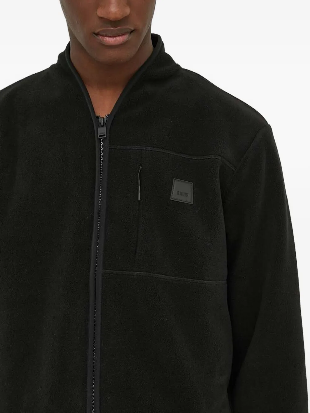 Rains Fleece jack met ritszak Zwart