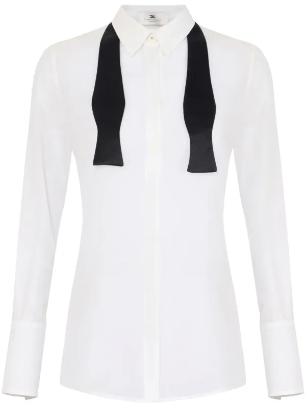 white shirt with black ribbon tie