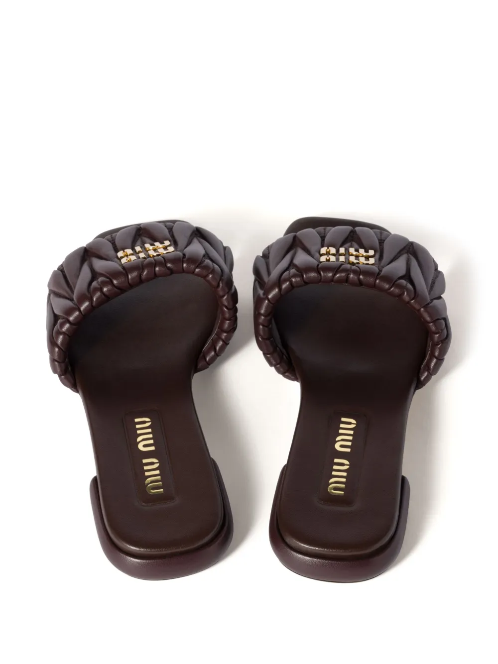 Miu matelassé leather slides Brown