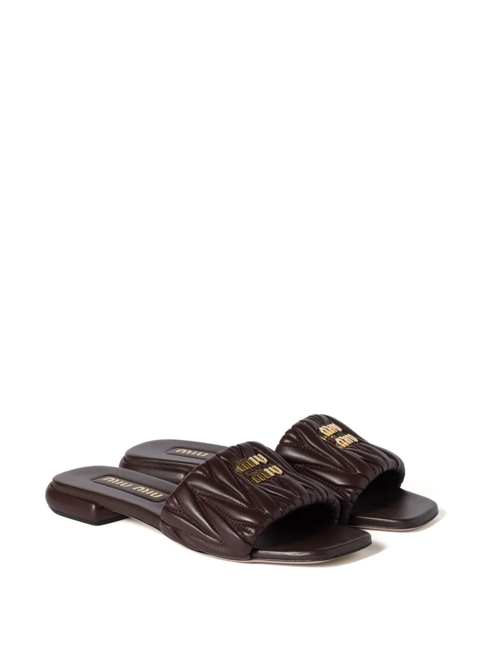 Miu matelassé leather slides Brown