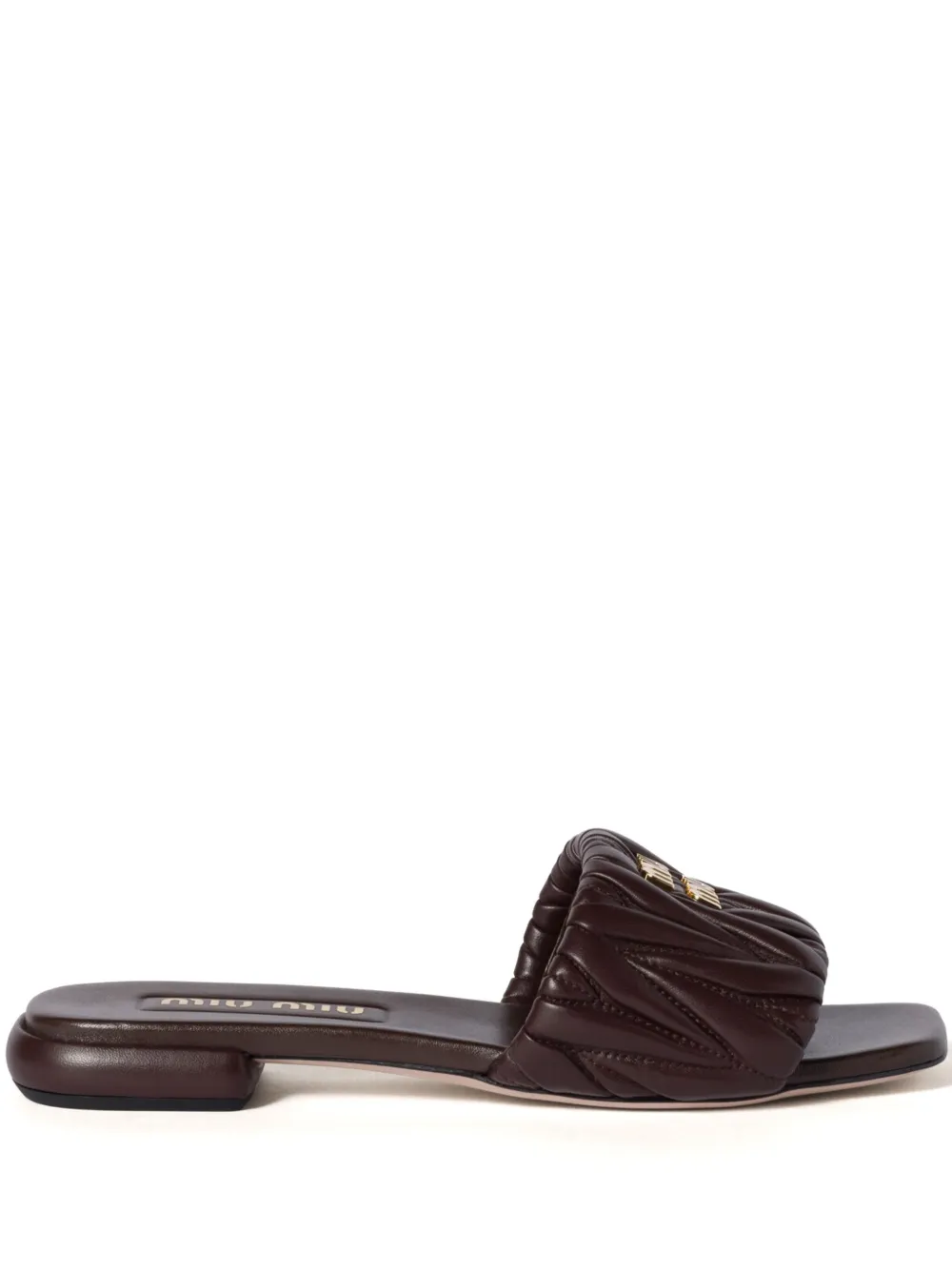 Miu matelassé leather slides Brown