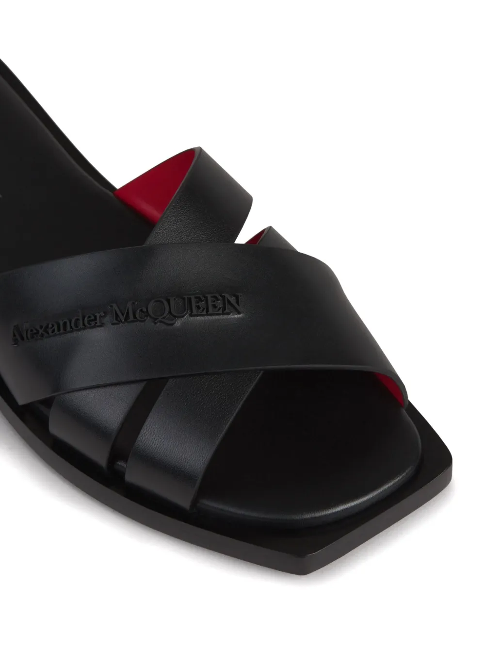 Alexander McQueen Slippers met gekruiste bandjes en logo-reliëf Zwart