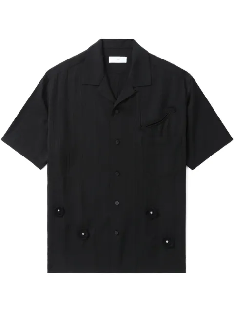 Toga camisa con aplique floral