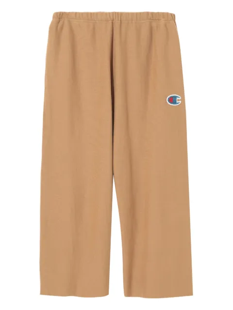 Undercover logo-patch raw-edge pants