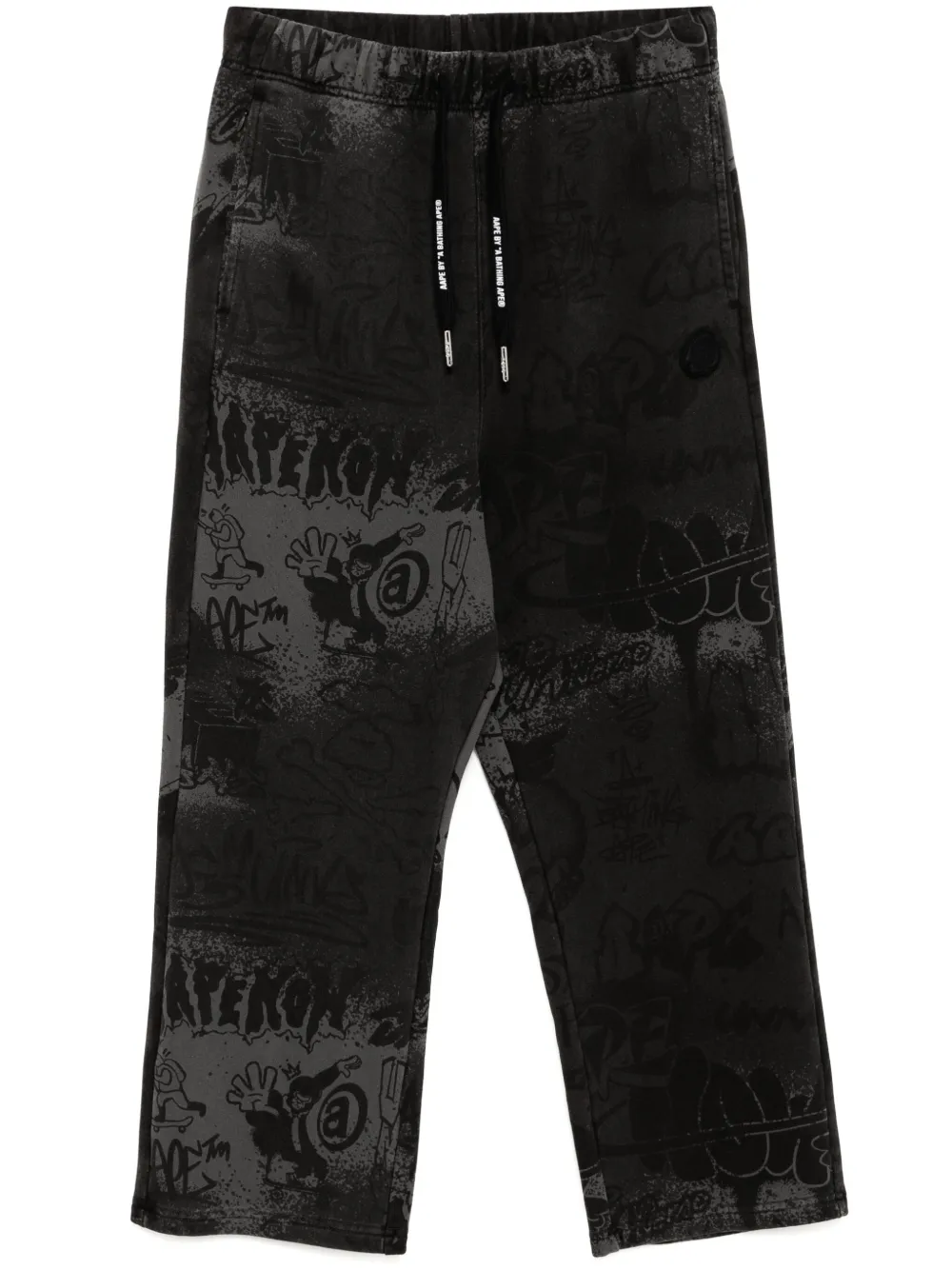 AAPE BY *A BATHING APE® graffiti-print track pants | Black | Image 1