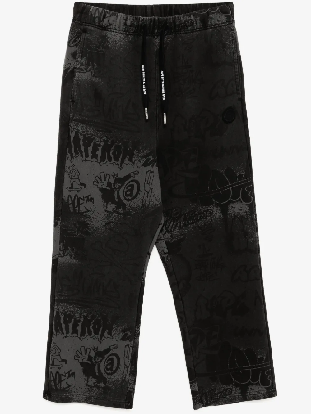 AAPE BY *A BATHING APE® graffiti-print track pants | Black | Image 1