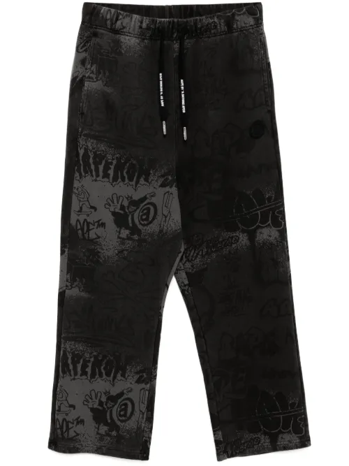 Pantalon de jogging à imprimé graffiti - AAPE BY *A BATHING APE® - Modalova