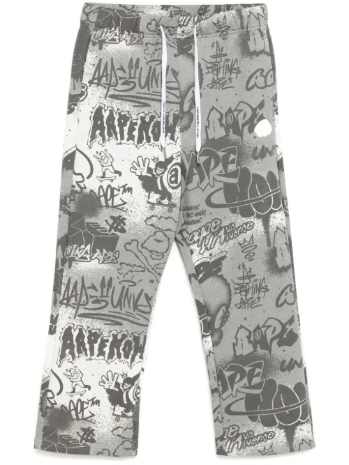 Pantalon de jogging à imprimé graffiti - AAPE BY *A BATHING APE® - Modalova
