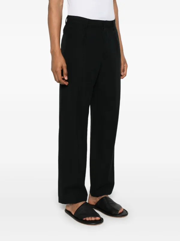 Auralee pleated-detail Trousers | Black | FARFETCH
