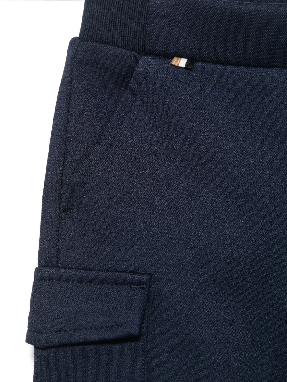 BOSS Kidswear Trainingsbroek met toelopende pijpen Blauw