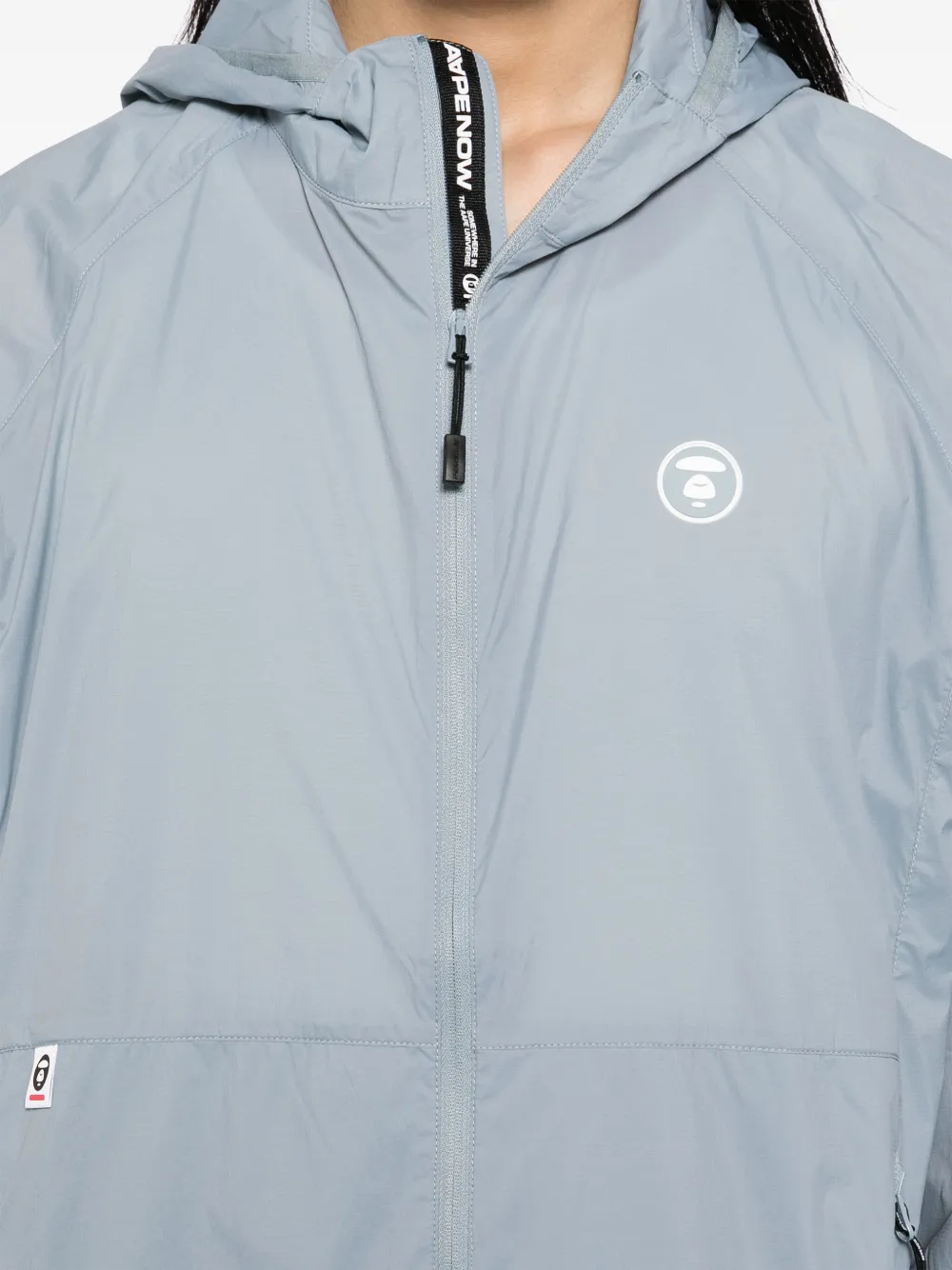 AAPE BY *A BATHING APE Windjack met Moonface-logo Grijs