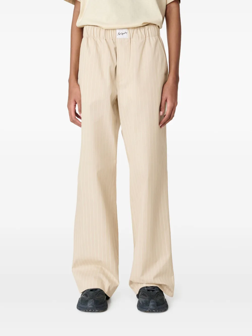 Axel Arigato Gestreepte katoenen broek Beige