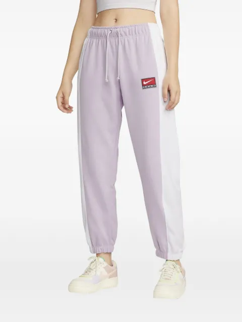 Nike colour-block "Doll/White" track trousers