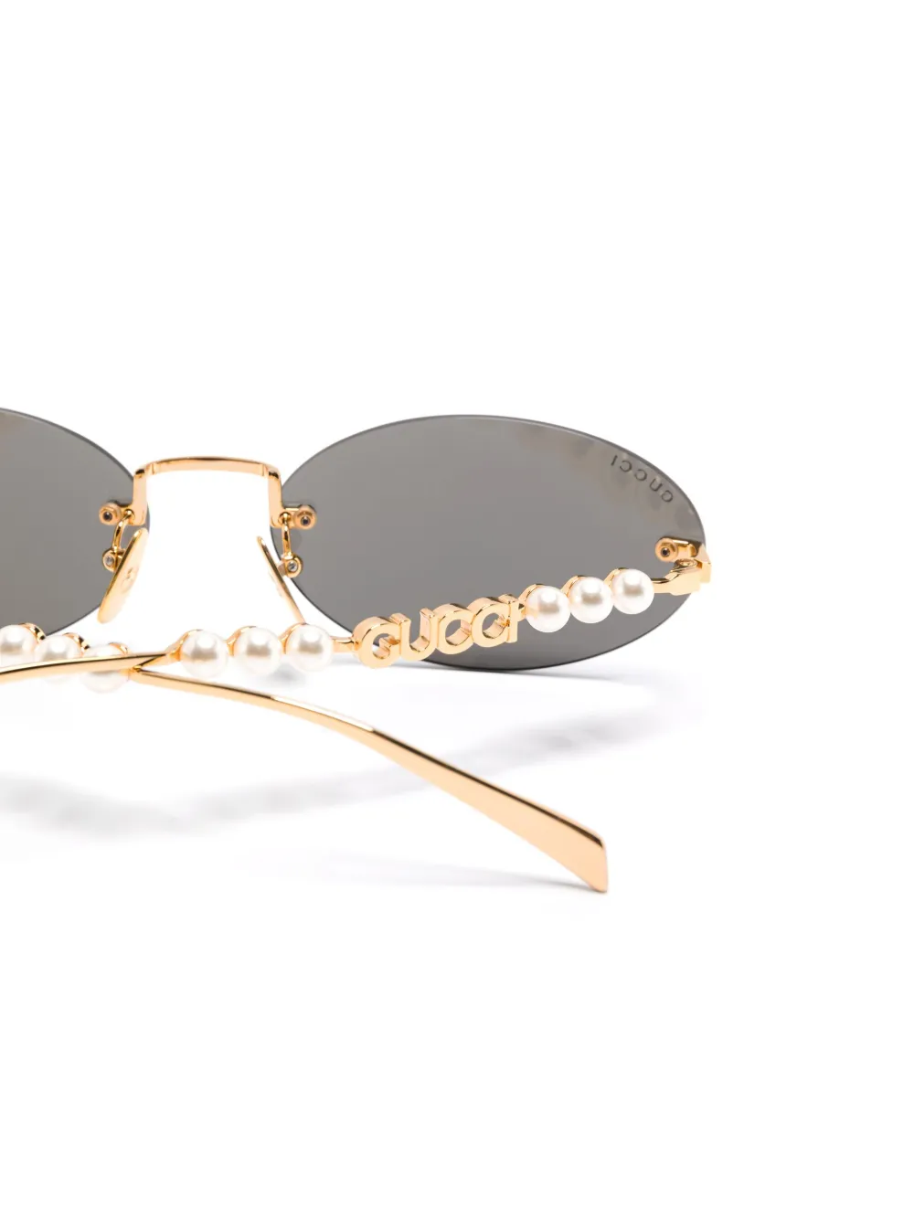 Gucci Eyewear Zonnebril met ovalen montuur Goud