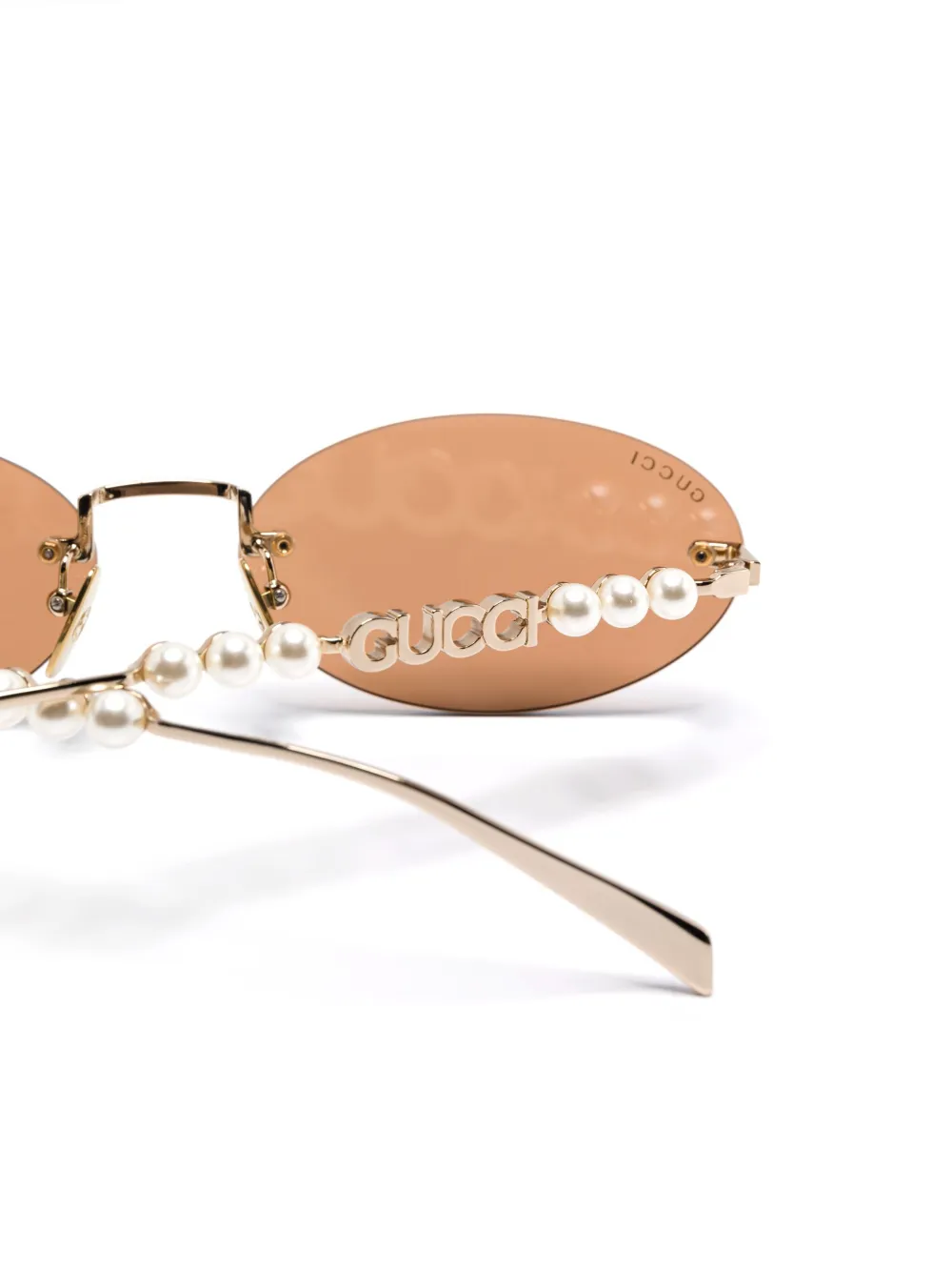 Gucci Eyewear Zonnebril met randloze montuur Goud