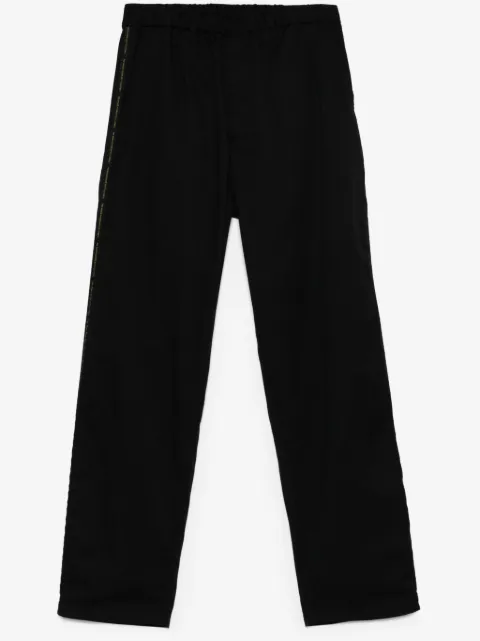 Undercover logo tape-detail trousers