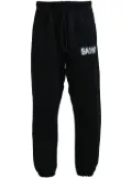 SAINT MXXXXXX logo-print track pants - Black