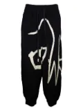 Haculla graphic-print wool trousers - Black